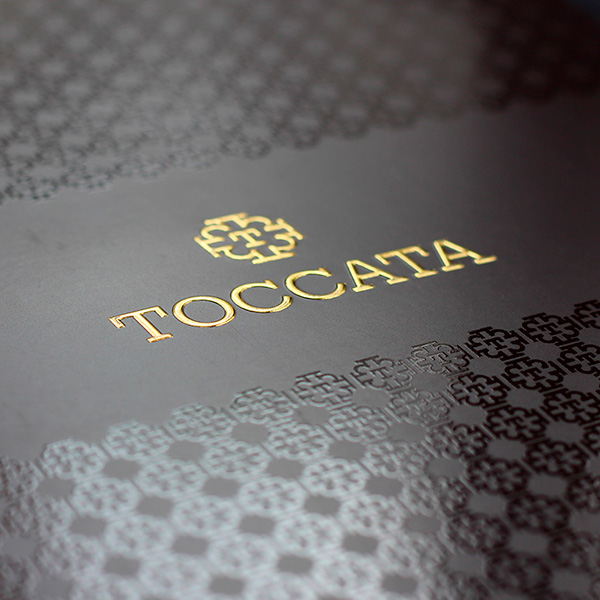 Here is an example of foiled, embossed text with a surrounding UV pattern.